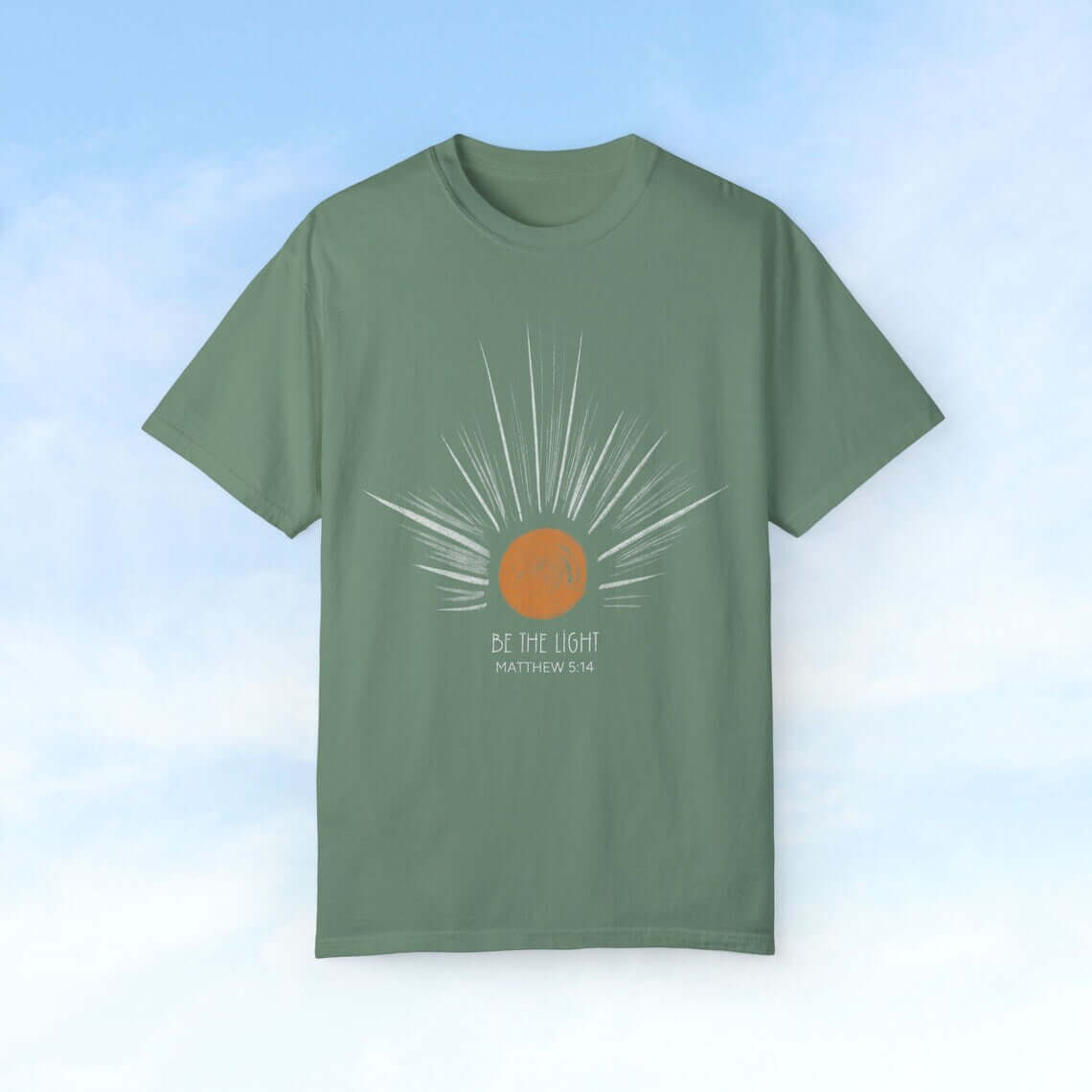 Be the Light sunburst Christian tee with sun rays and Bible verse, perfect celestial Christian gift for Mom. Trendy boho faith apparel.