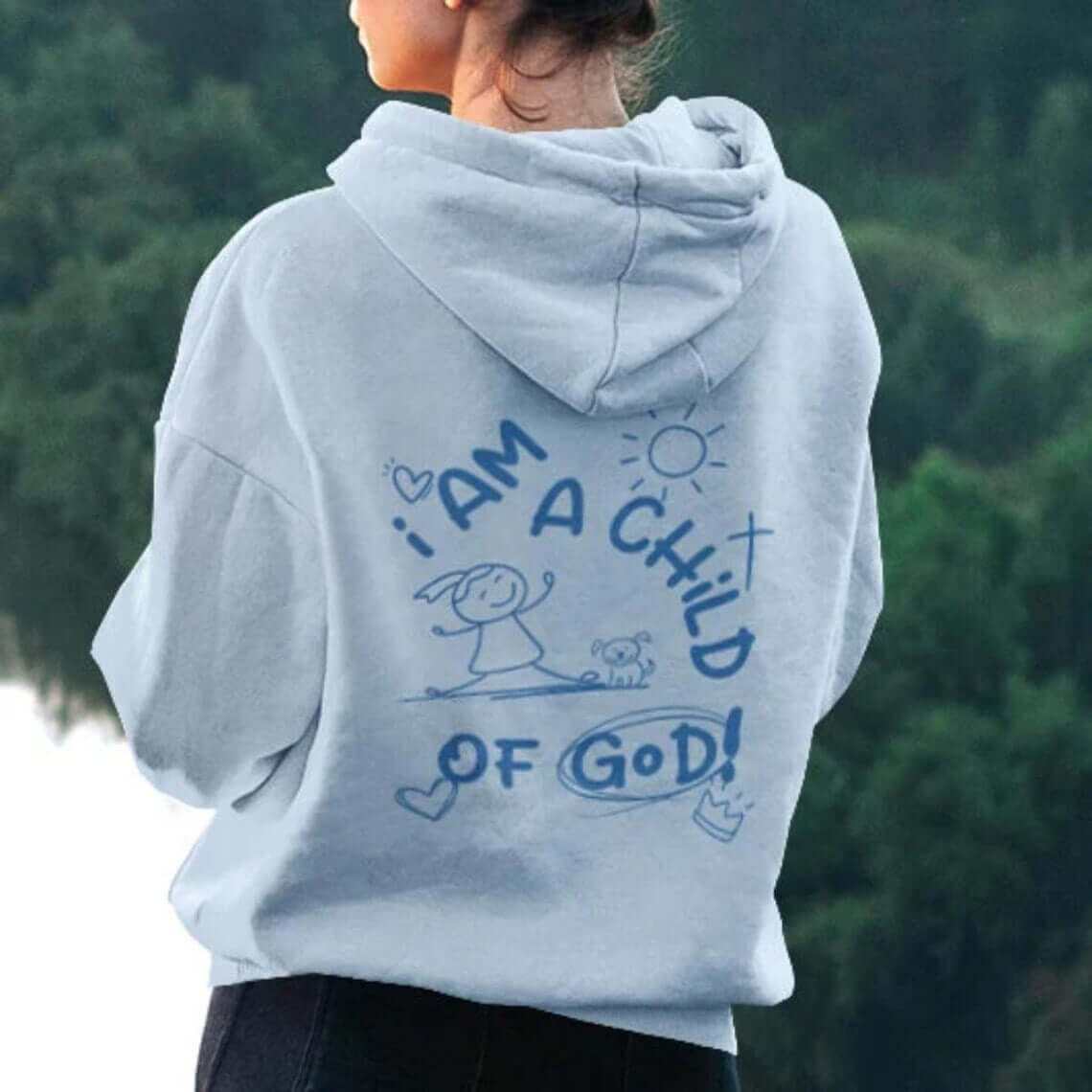 Woman wearing I Am A Child Of God With Dog Christian Hoodie with inspirational faith-based design in nature.