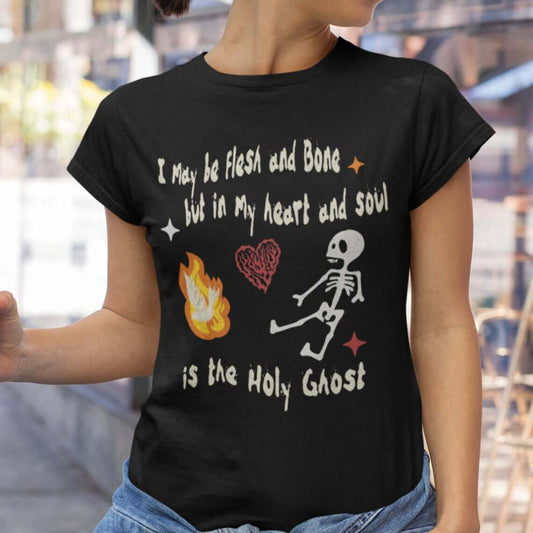 Christian Halloween shirt with dancing skeleton and heart graphic, featuring "In My Heart And Soul Is The Holy Ghost" scripture.