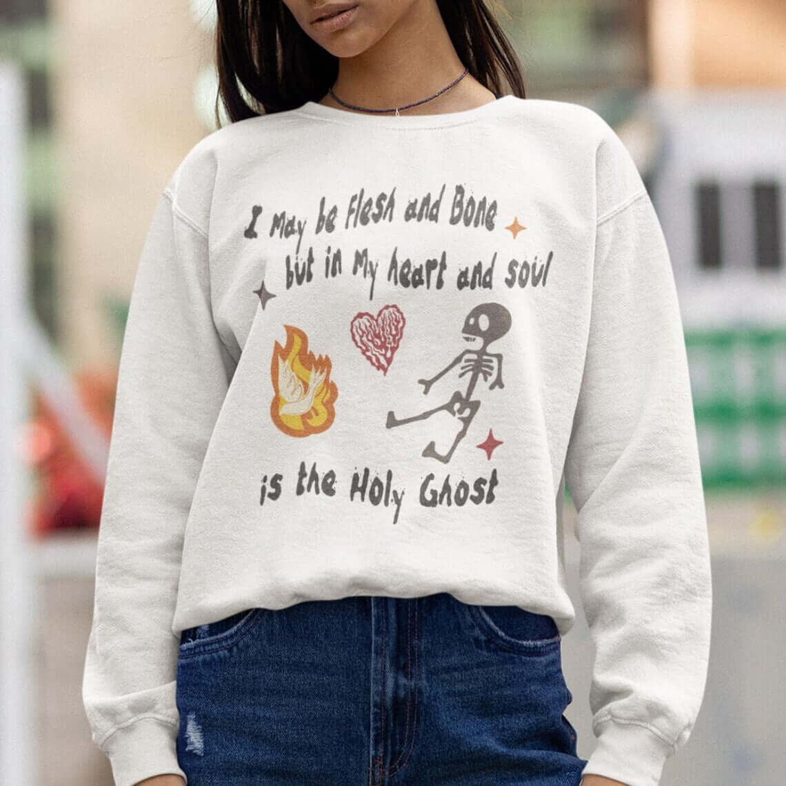 Christian Halloween sweatshirt with "I May Be Flesh and Bone but In My Heart and Soul is the Holy Ghost" and dancing skeleton design.